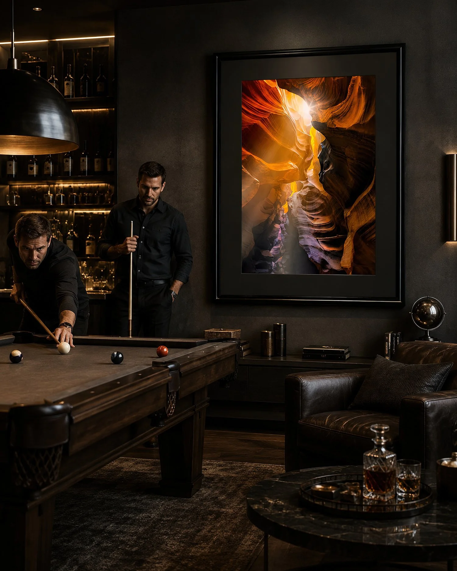 Black-framed canyon photograph with a black mat in a dark moody man-cave with two men playing pool by Nick Psomiadis at NIKART Studio and Gallery