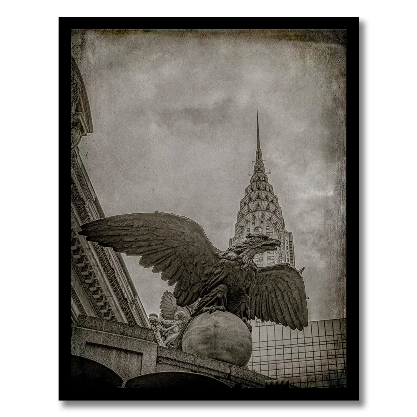 black and white photograph of grand central eagle with chrysler building behind