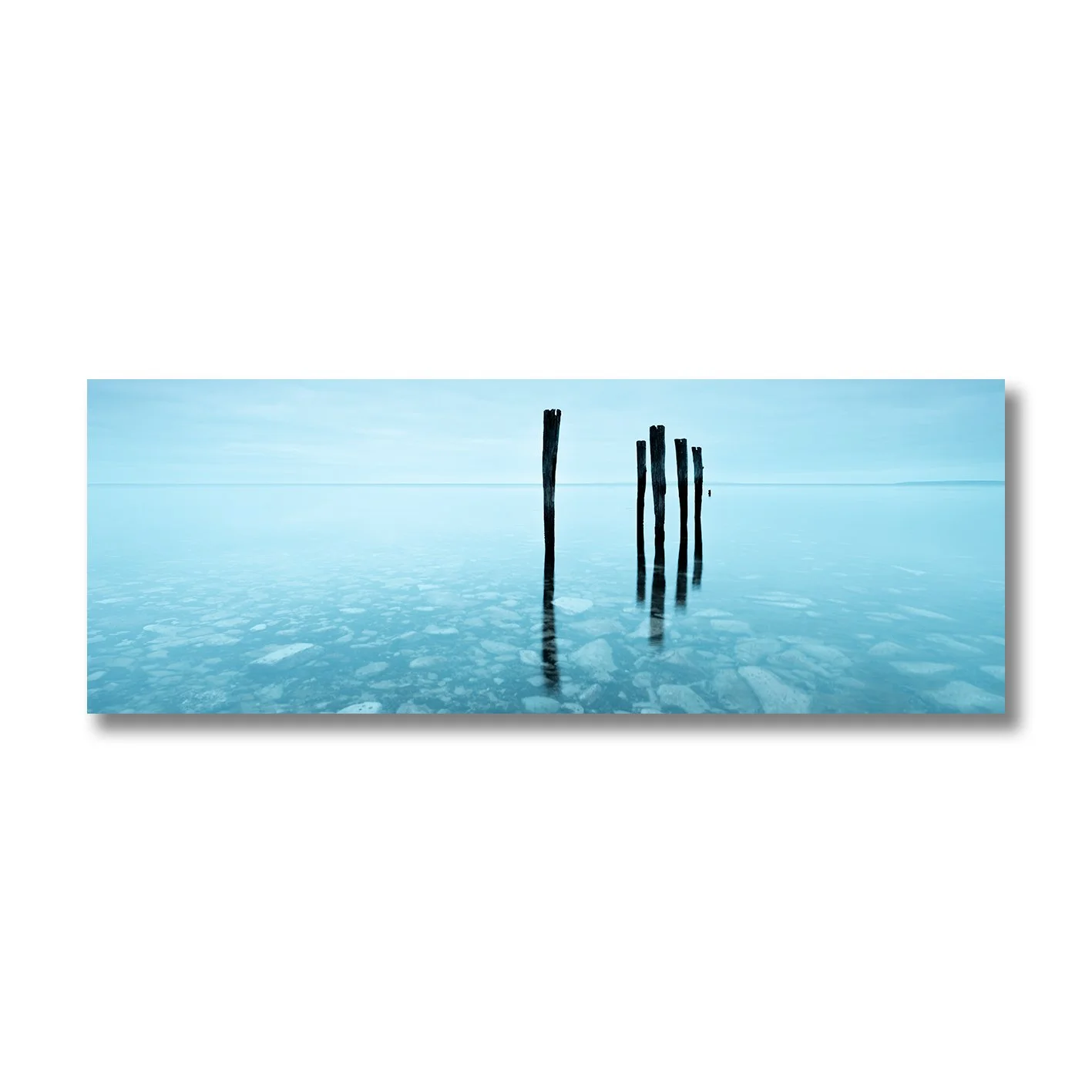 Fine art photograph of Kingscote Old Jetty wooden pylons over calm blue water