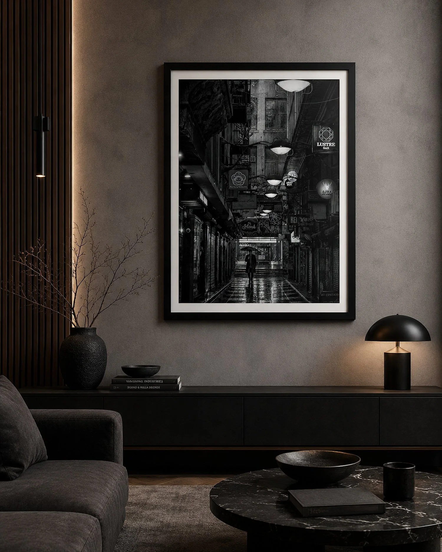 Framed black-and-white Melbourne laneway photograph in a moody modern living room with dark furnishings and warm accent lighting by Nick Psomiadis at NIKART Studio and Gallery