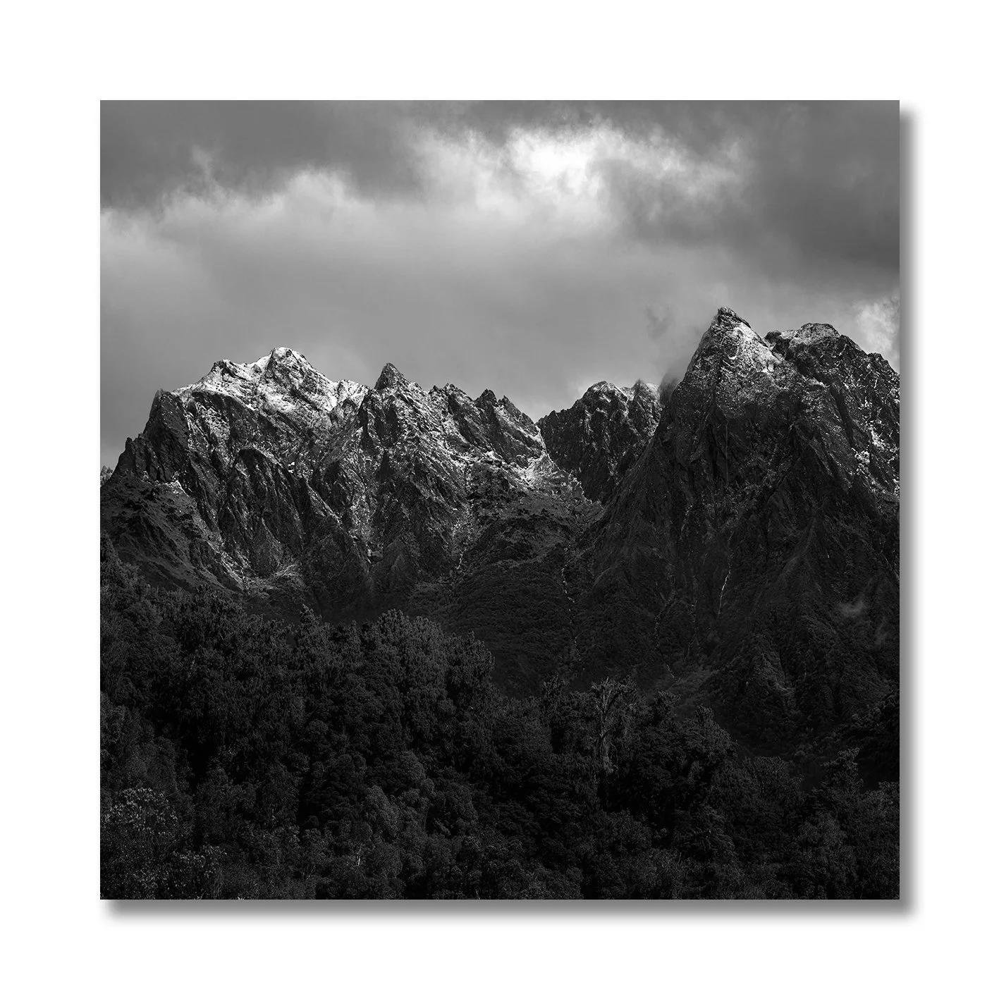 black and white mountain landscape photograph of snow-capped peaks