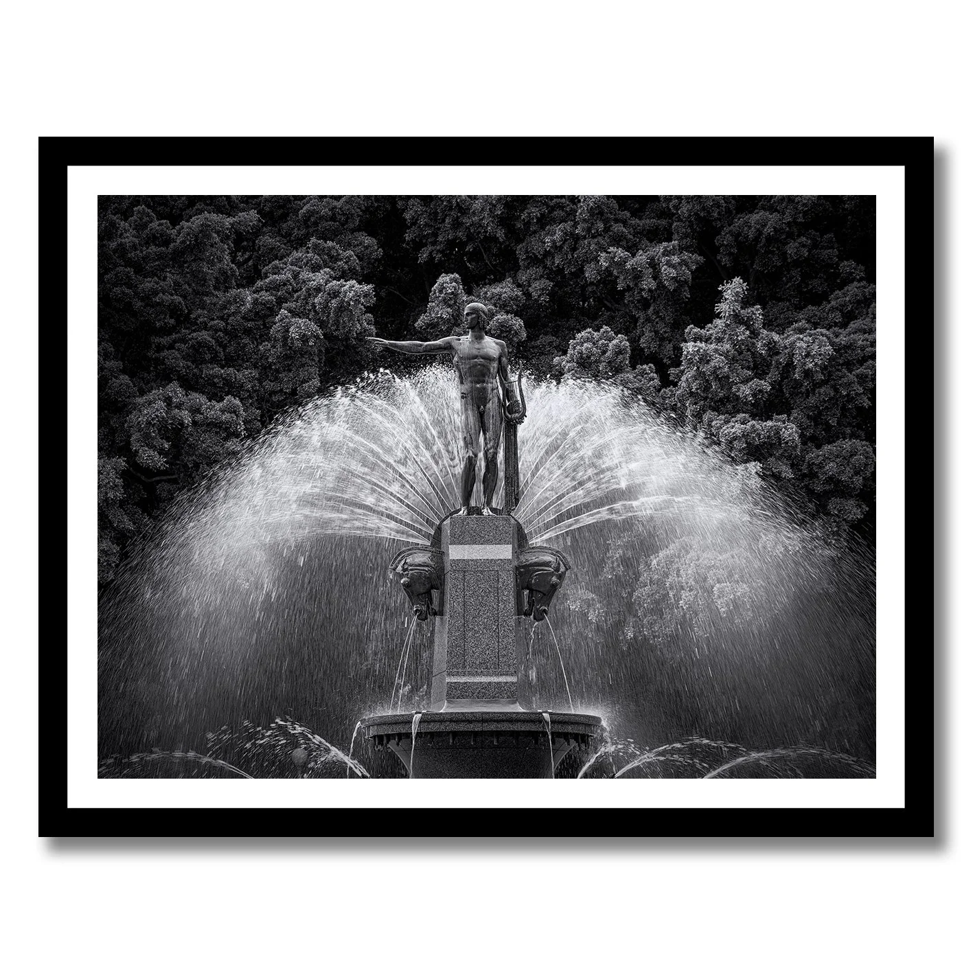 Black and white photograph of the Archibald Fountain statue with water spray in Hyde Park