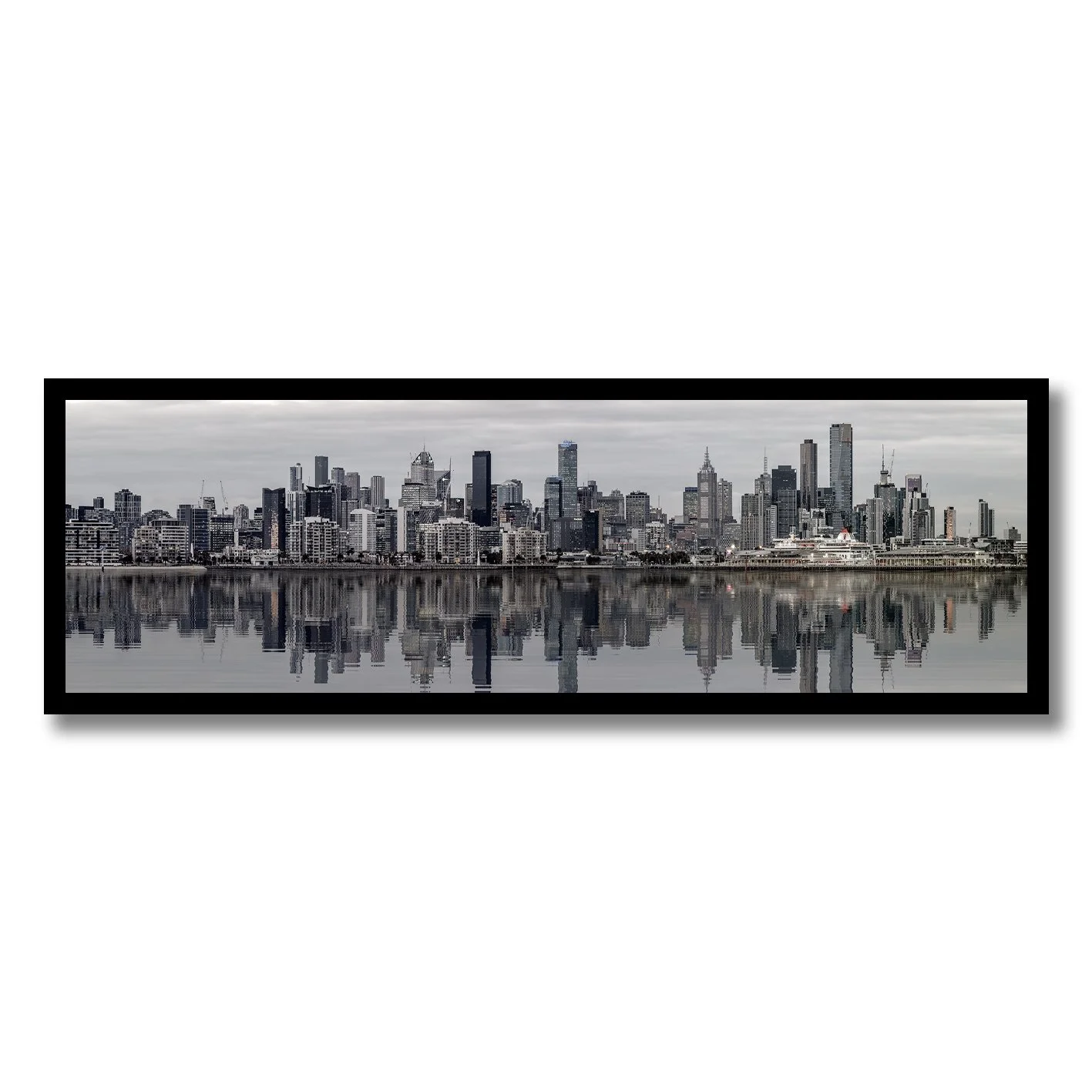 black and white photograph of melbourne skyline reflected on calm water