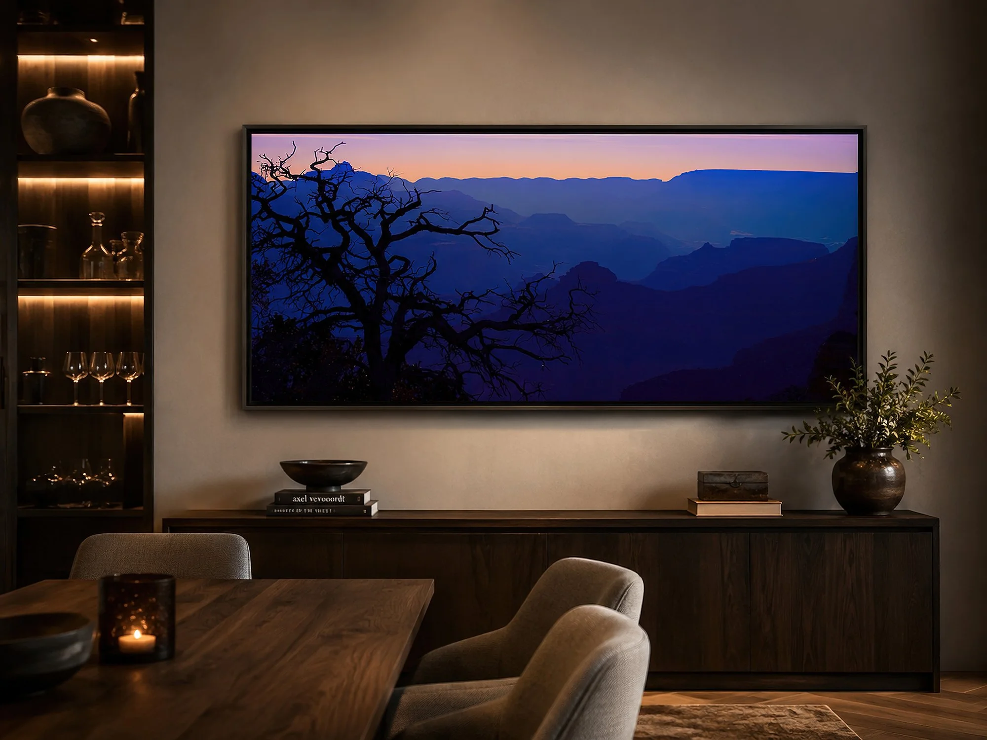 Framed Grand Canyon dawn canvas print displayed with a shadow-gap floating frame in an elegant dining room with warm ambient lighting.