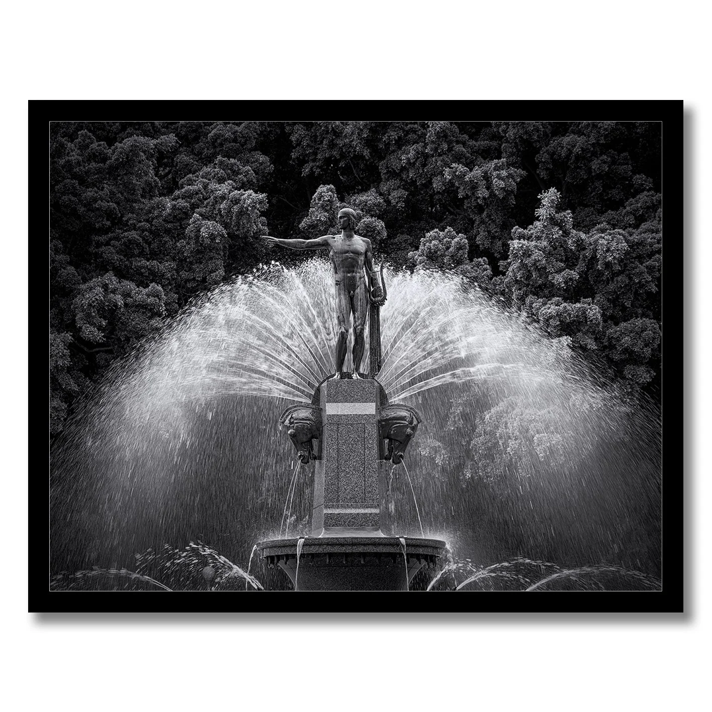 Black and white photograph of the Archibald Fountain statue with water spray in Hyde Park