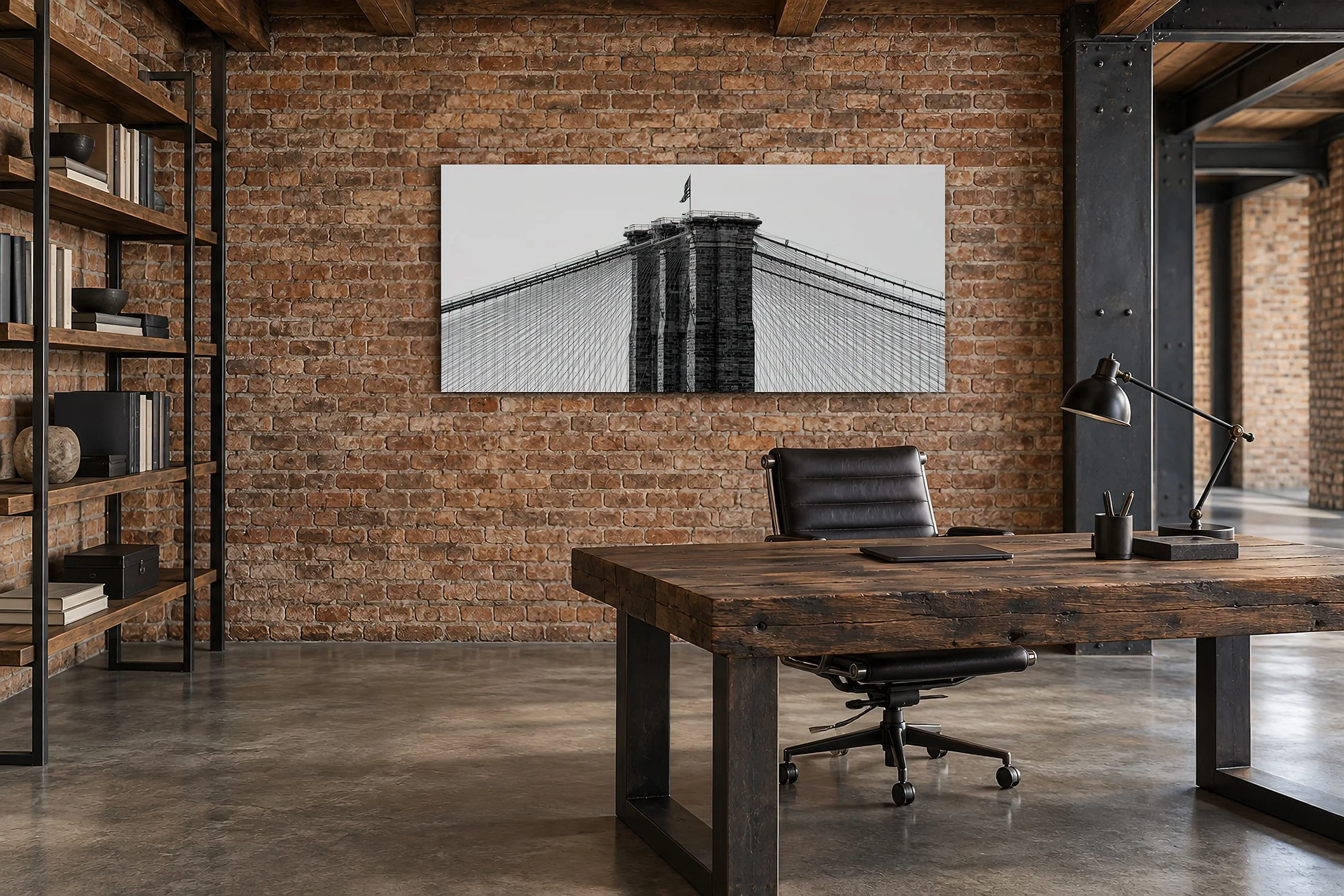 Brooklyn Bridge black and white fine art canvas print by Nick Psomiadis above a timber desk in an industrial study, NIKART.