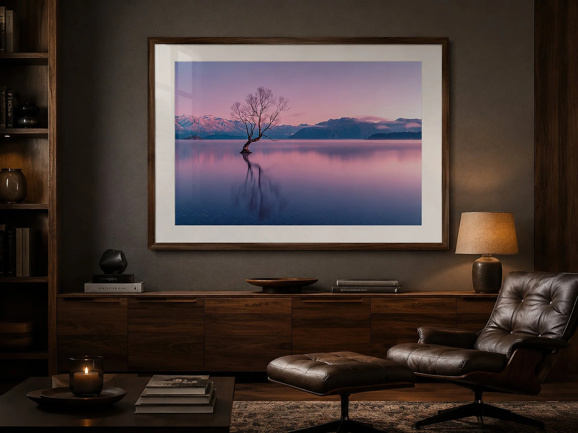 Framed Lake Wānaka tree photograph in a masculine dark-toned interior with walnut cabinetry, leather lounge chair and warm ambient lighting by Nick Psomiadis at NIKART Studio and Gallery