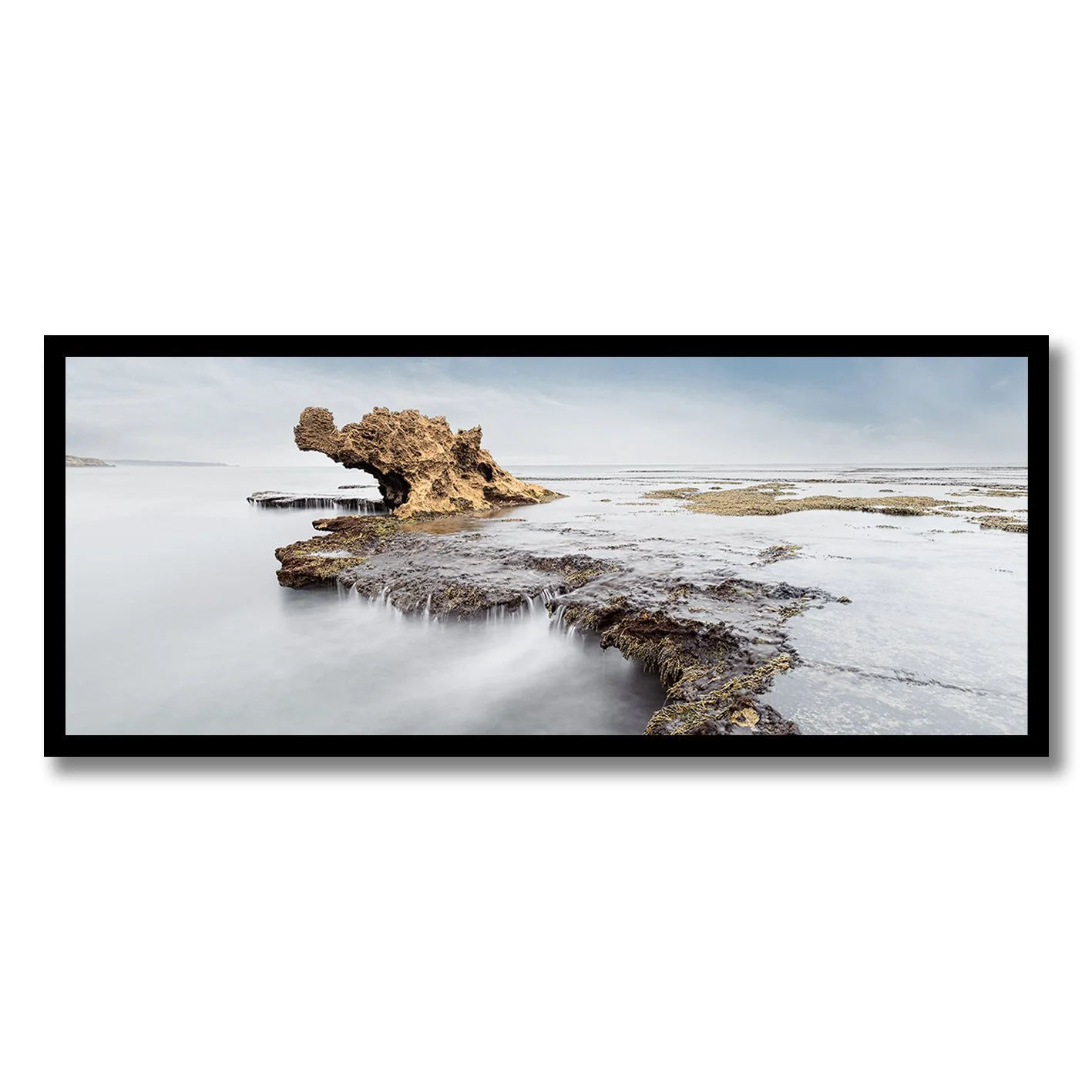 fine art photograph of dragons head rock formation mornington peninsula with soft water motion