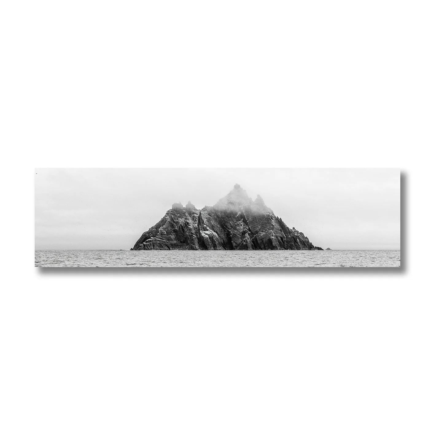 black and white photograph of skellig michael island rising from the atlantic ocean