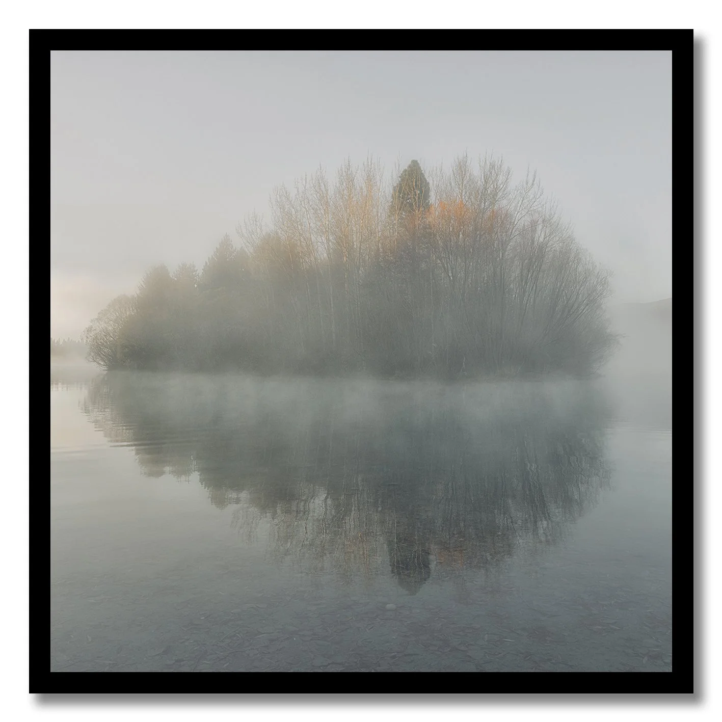 photograph of misty island reflection on lake in twizel new zealand