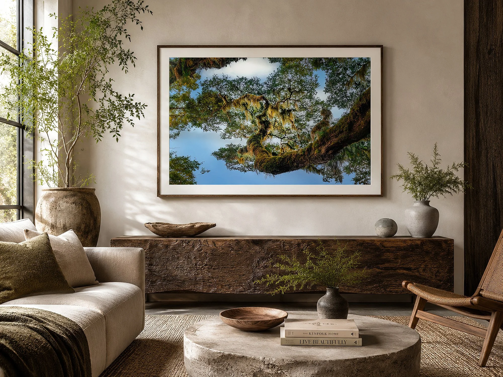 Framed moss-covered forest canopy photograph in a rustic dining room with a timber table, leather chairs and warm natural textures by Nick Psomiadis at NIKART Studio and Gallery
