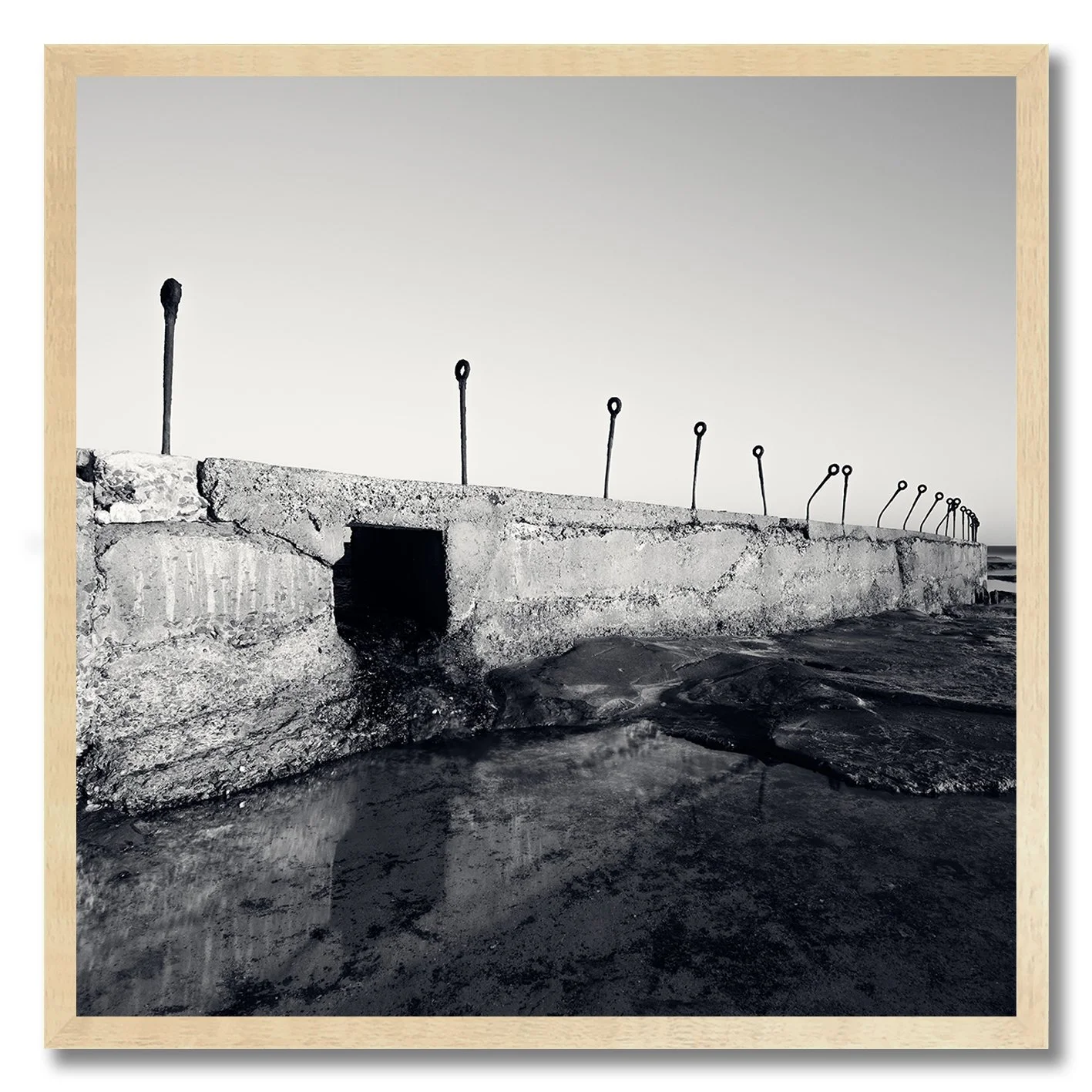 black and white photograph of coastal concrete structure