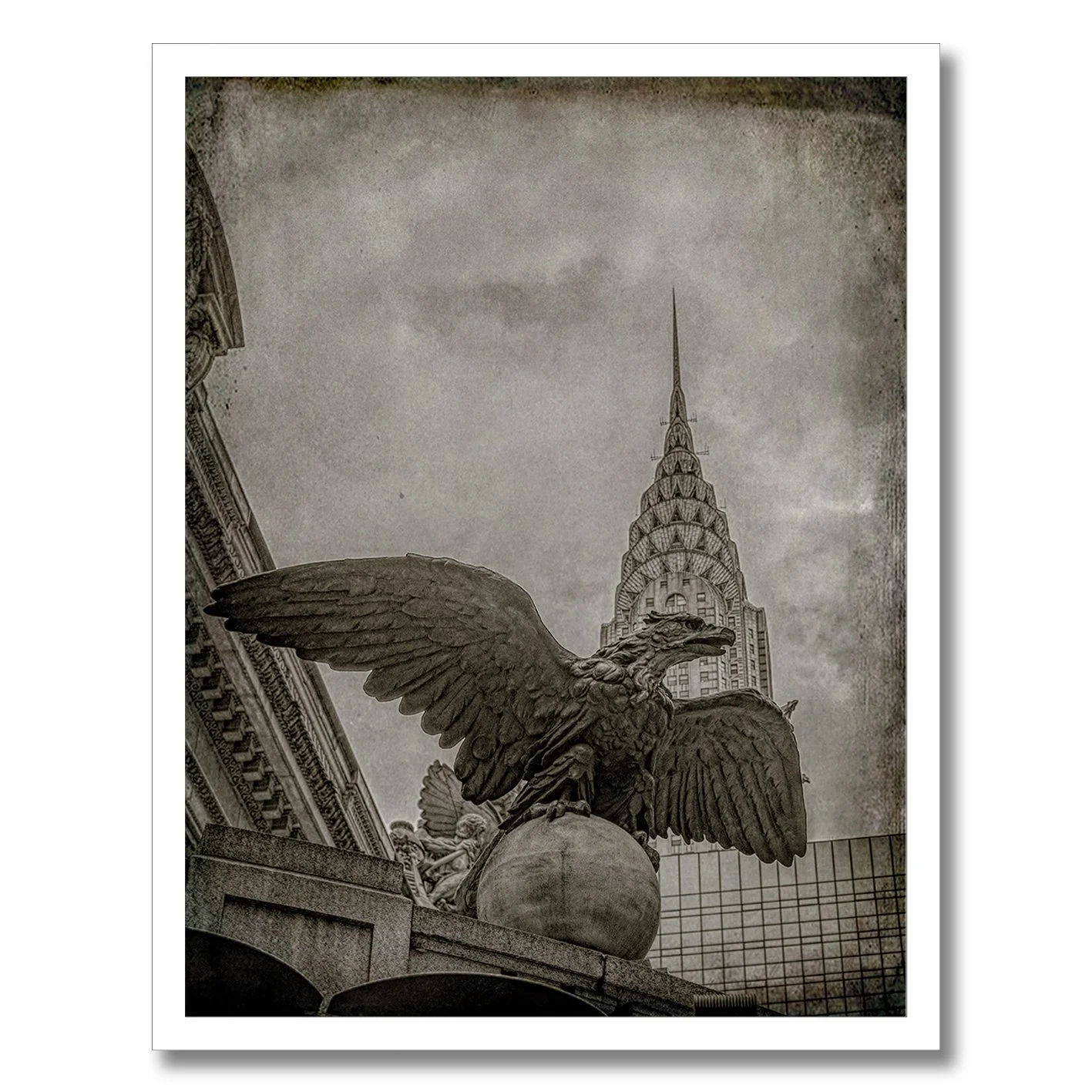 black and white photograph of grand central eagle with chrysler building behind
