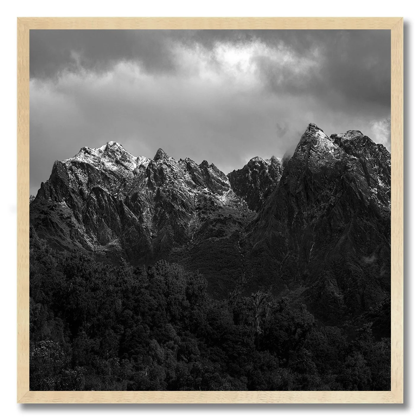 black and white mountain landscape photograph of snow-capped peaks