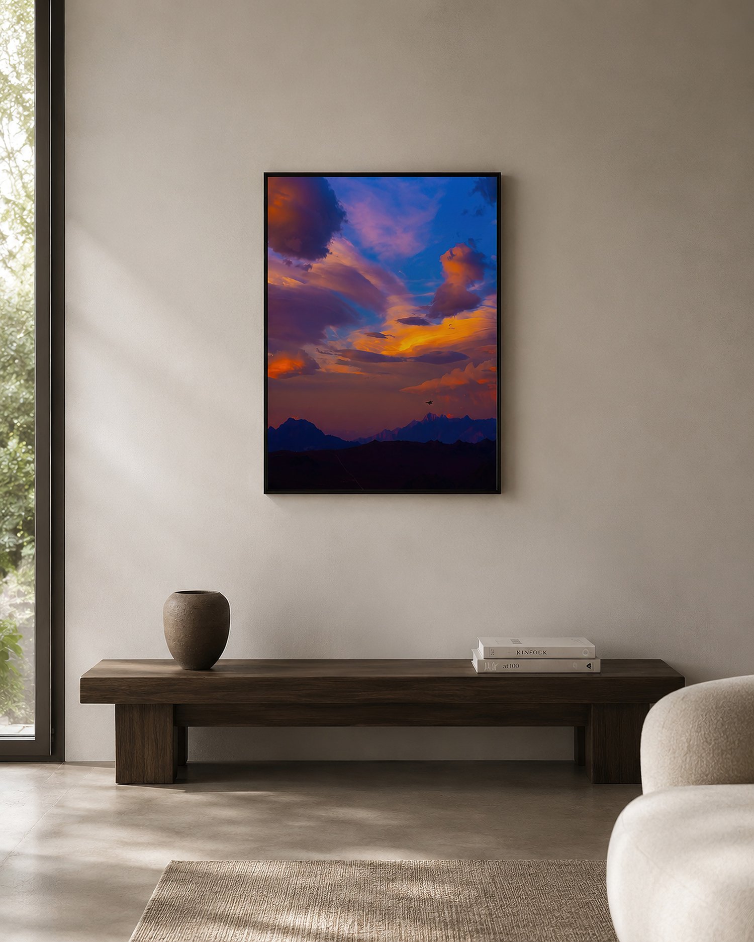 Framed sunset mountain photograph above a timber bench in a clean, minimal interior by Nick Psomiadis at NIKART Studio and Gallery