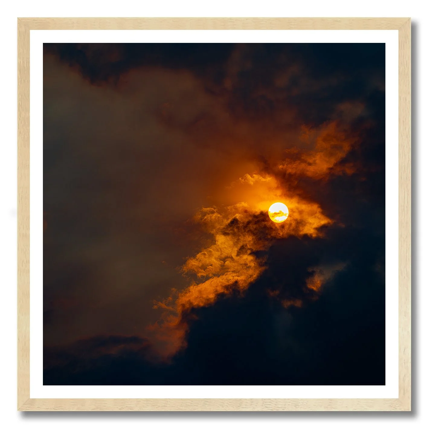 Sun breaking through golden clouds in a dramatic fine art photograph