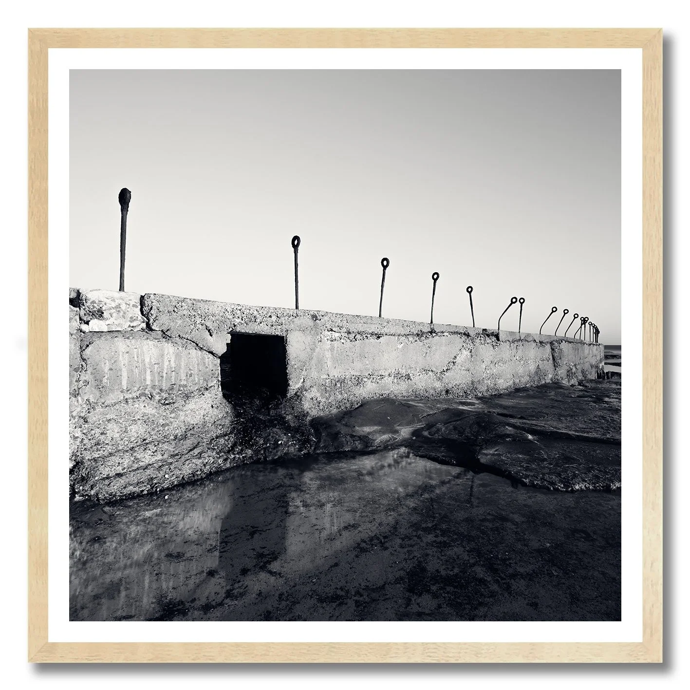 black and white photograph of coastal concrete structure