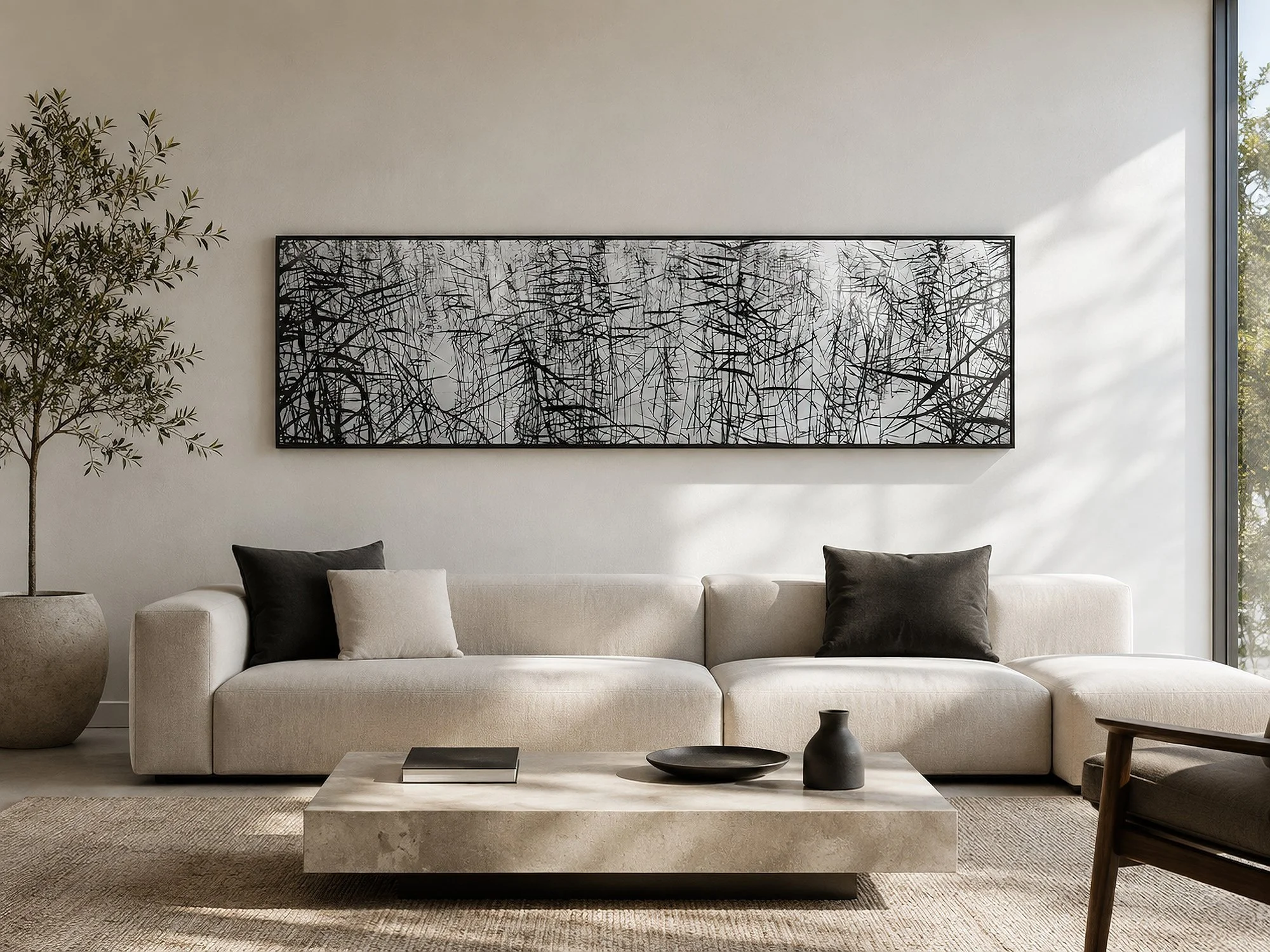 Bright modern minimalist living room with a large framed Sumi Ashi black and white reed reflection photograph above a cream sofa, natural light and neutral décor, by Nick Psomiadis at NIKART Studio and Gallery