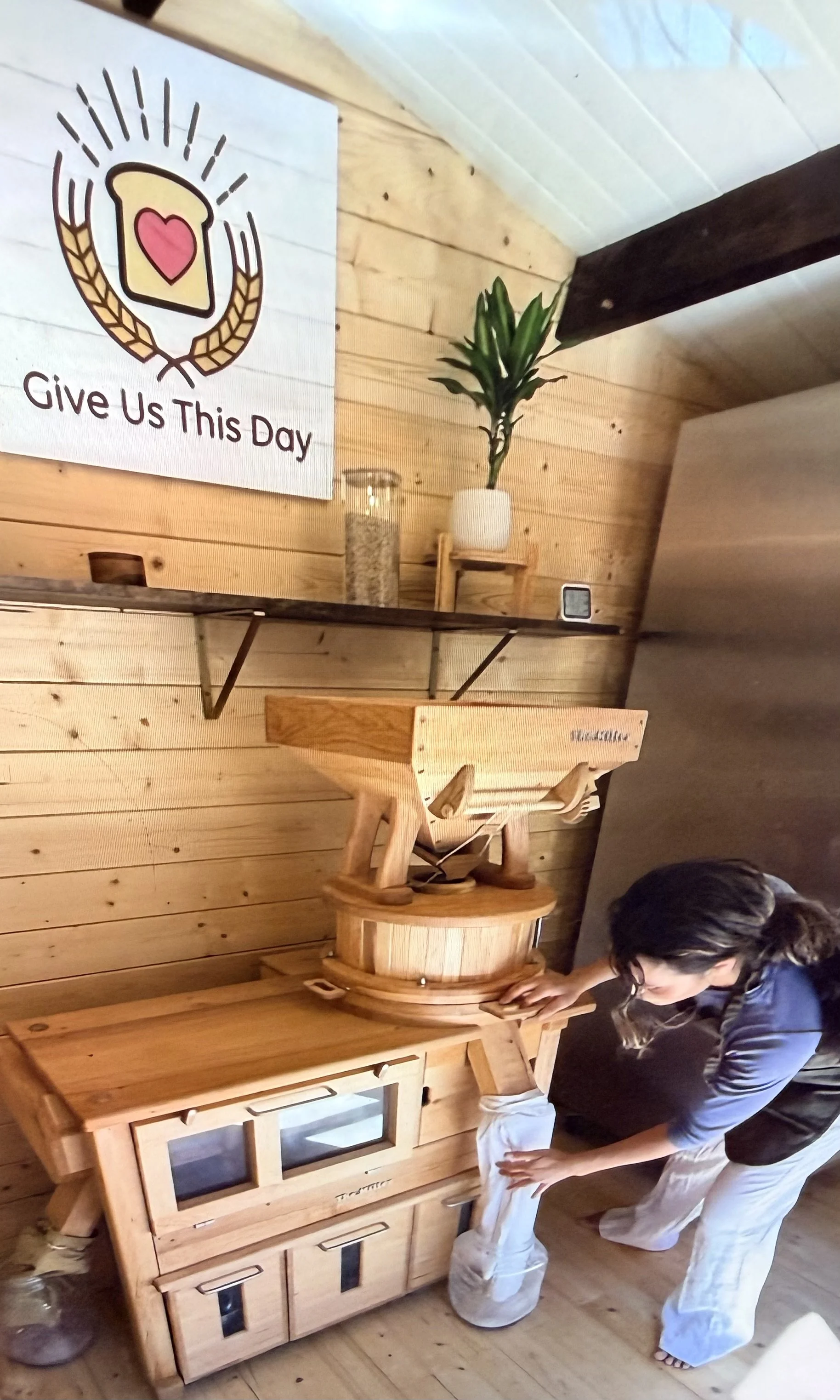 The Cbad miller, Claris Oas micro-bakery in North County San Diego, making freshly milled flour from ancient organic grains for her community and friends for Sunday pick up.