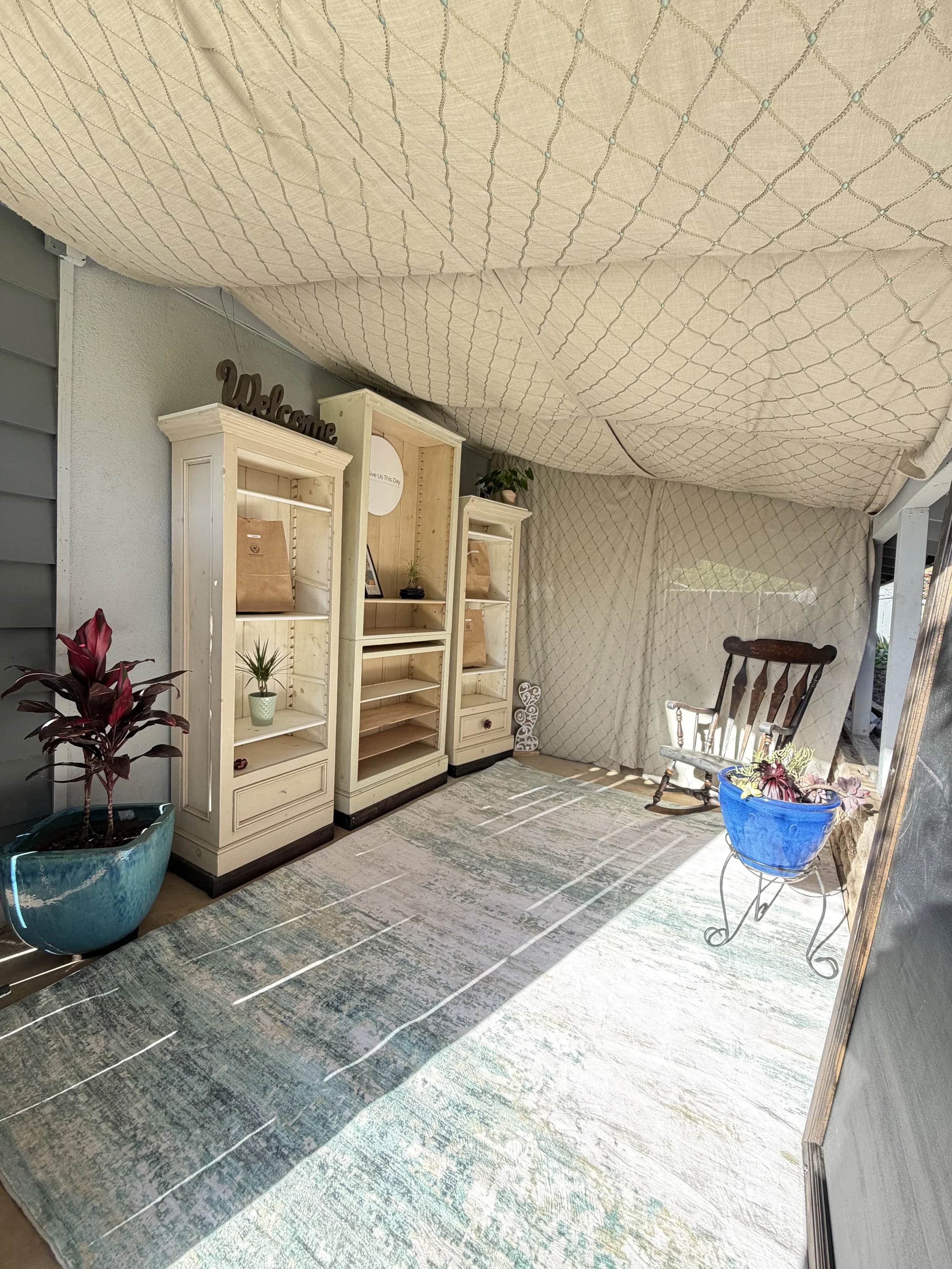 The inside of the pick up site (2.0) for Give Us This Day micro-bakery where one feels the sense of walking through fields of wheat as they enter and pick-up their baked goods and/or freshly stoned milled flour.