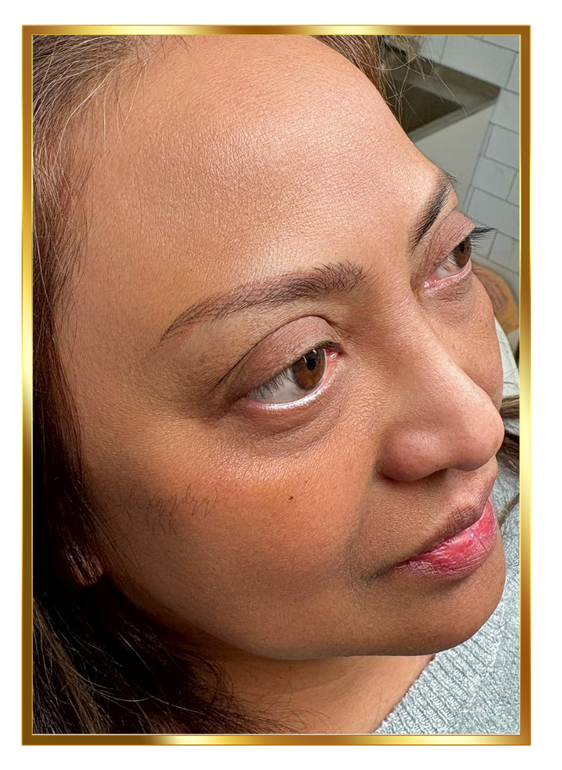 Close-up of a woman's face showing her eyebrow threading or shaping process.