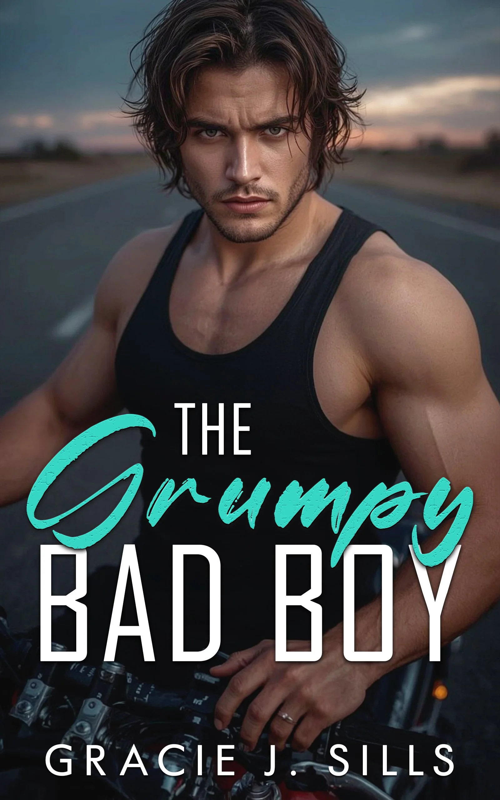 Cover of a book titled 'The Grumpy Bad Boy' by Gracie J. Sills, showing a shirtless, muscular man with wavy brown hair and piercing blue eyes, standing on an open road at sunset with a serious expression.