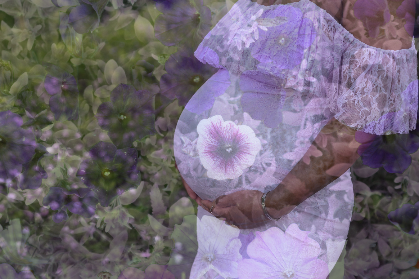 A pregnant woman wearing a light, lacy dress standing in a garden with purple and green flowers, with a double exposure effect.