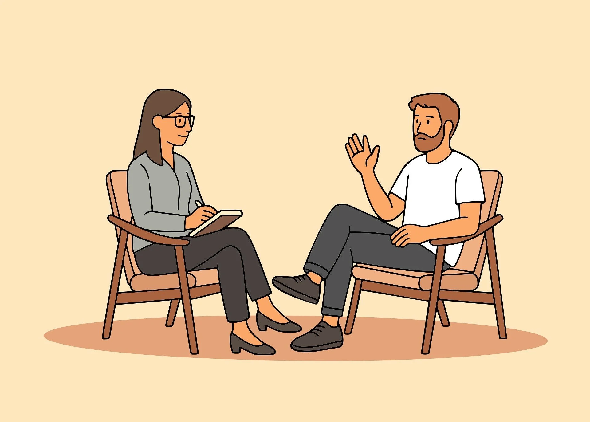 A man and a woman sitting in chairs facing each other, having a conversation. The woman is taking notes, and the man is gesturing with his hand.