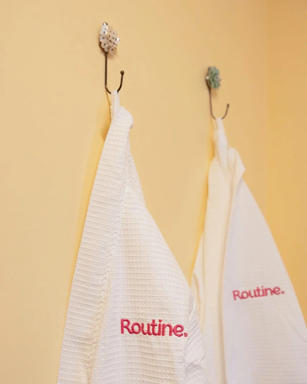 The towel situation? Handled.
⠀
When you book a sauna, your robe is waiting for you. Showering at Routine? We&rsquo;ve got the products AND the fluffy white towels. Free, obviously.
⠀
And yes, every workout room has complimentary sweat towels too, be