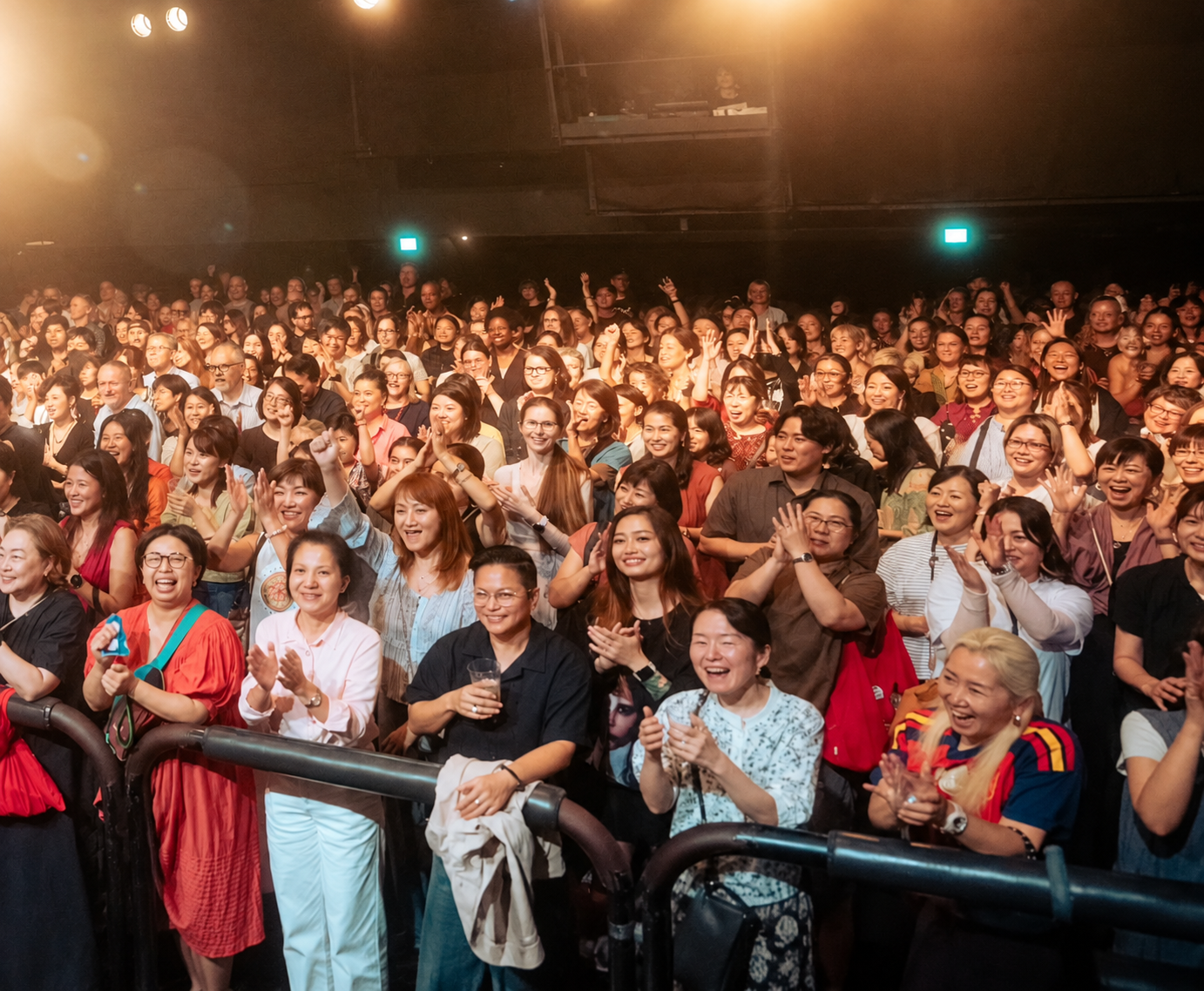 Joyful Crowd Under Concert Lights.png