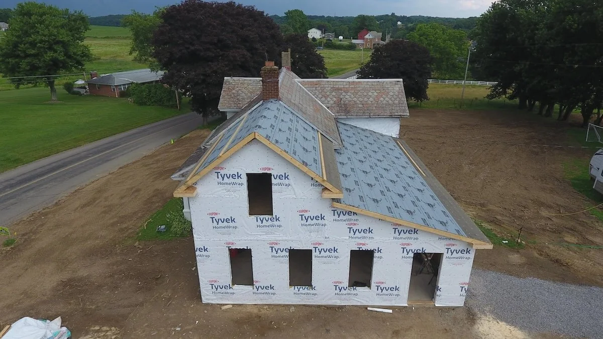 Side house addition framework and roof covered with breather membrane