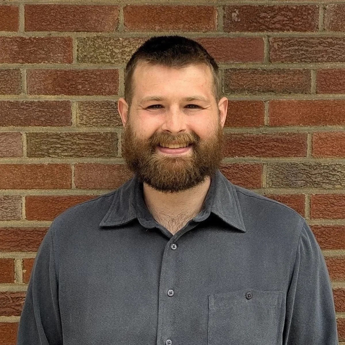 Headshot of Eli, owner of Heritage Deck and Frame