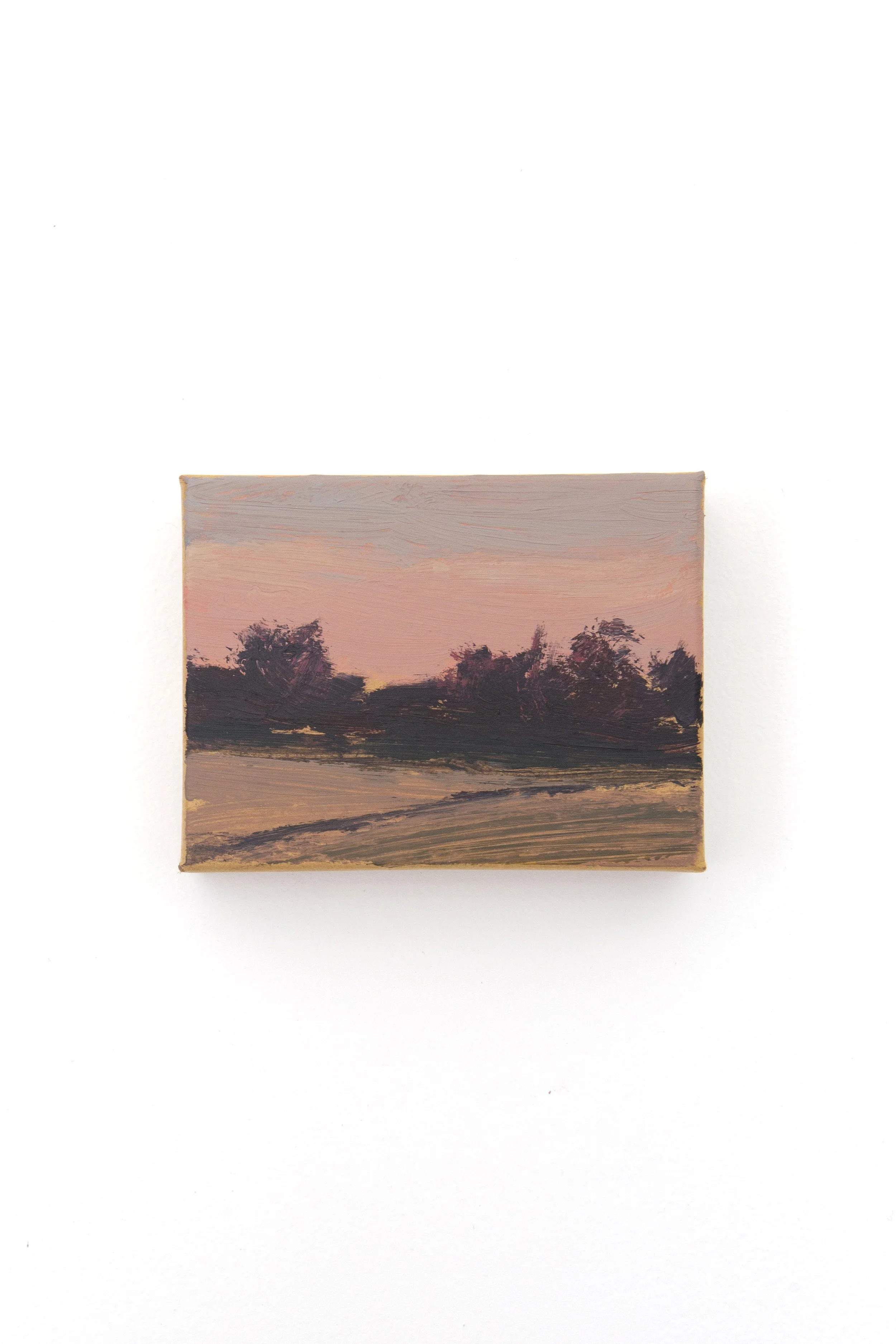 Small landscape painting of a sunset scene with trees and a field, featuring pink and purple hues in the sky.