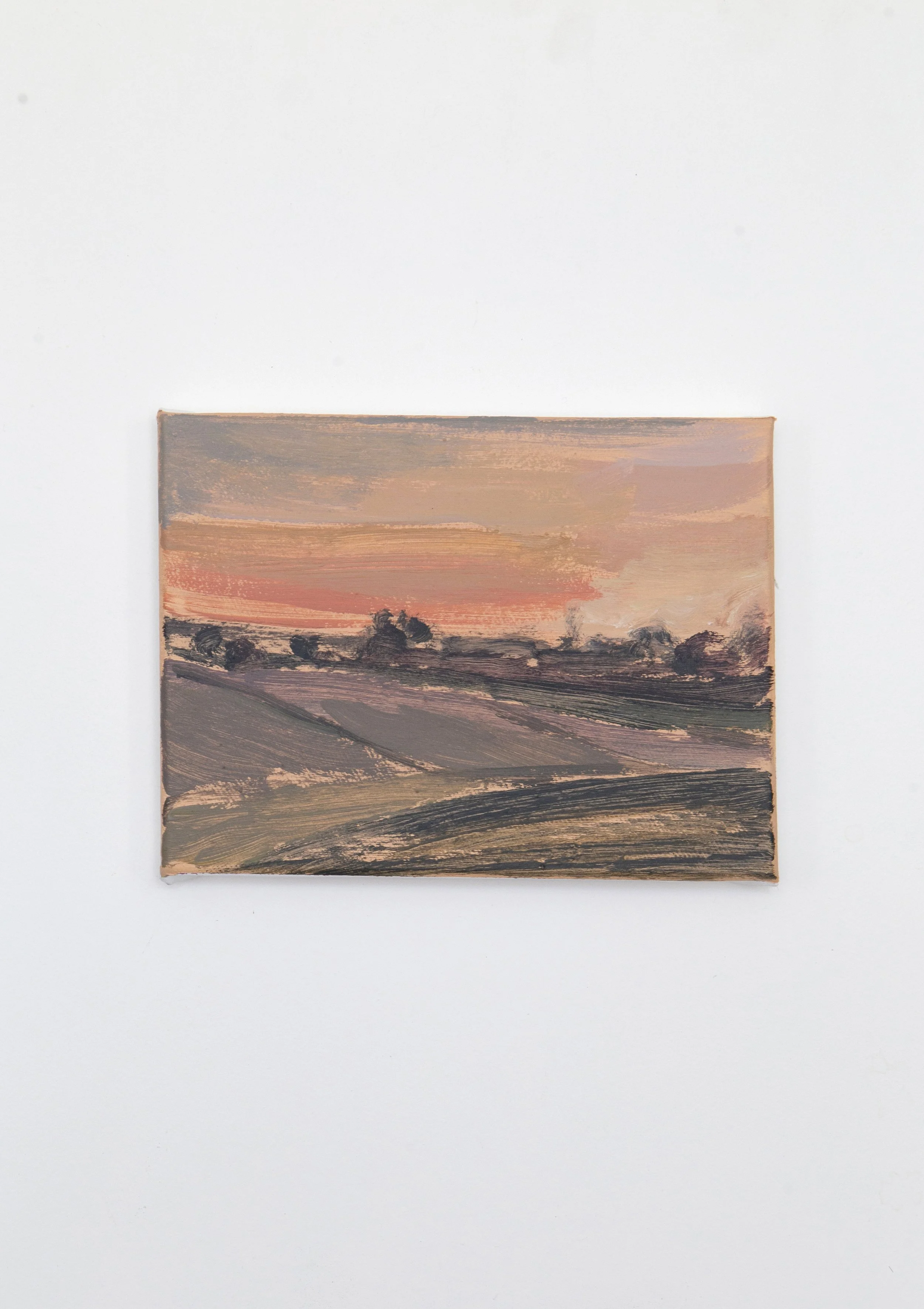 A landscape painting of rolling fields at sunset with a pinkish-orange sky and scattered trees in the distance.