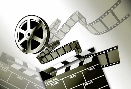 A film reel, several strips of film, and a film clapperboard on a white background.