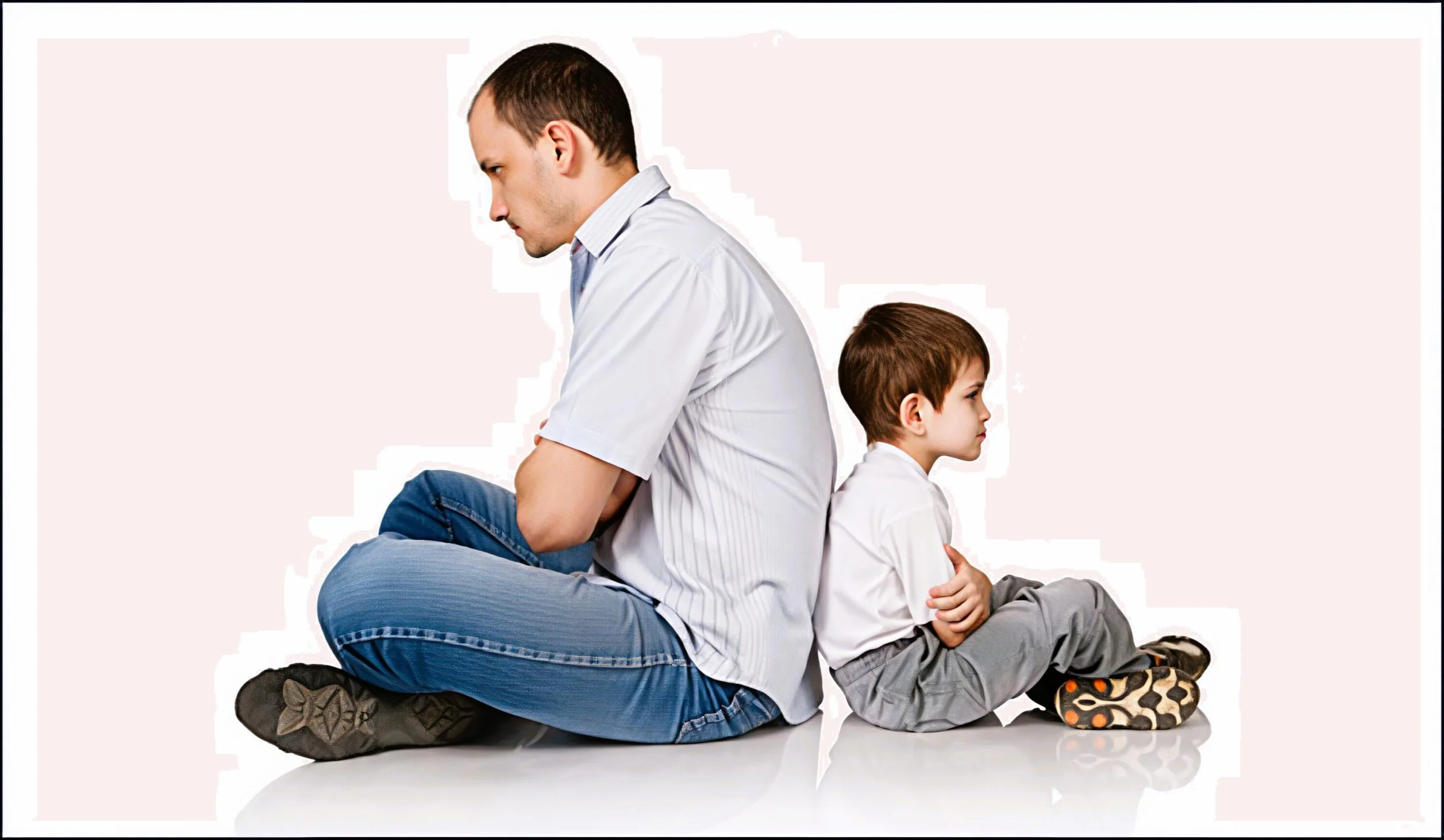 Father sitting quietly beside his autistic child during a calm moment of connection