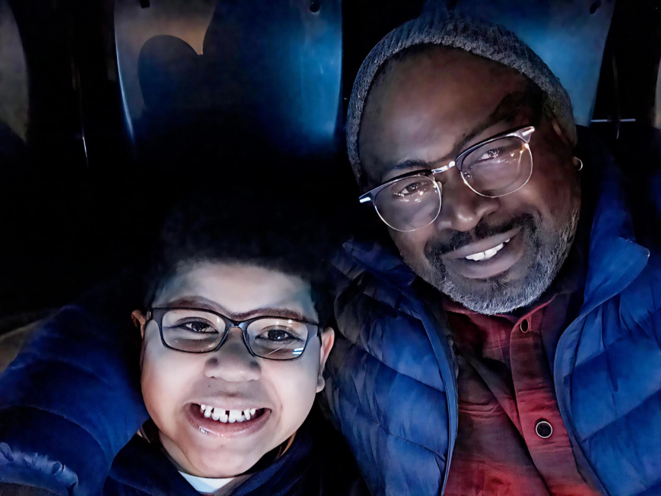 AMC Sensory Friendly Films promotional graphic showing a family enjoying a movie in a theater with adjusted lighting and sound for neurodivergent audiences.