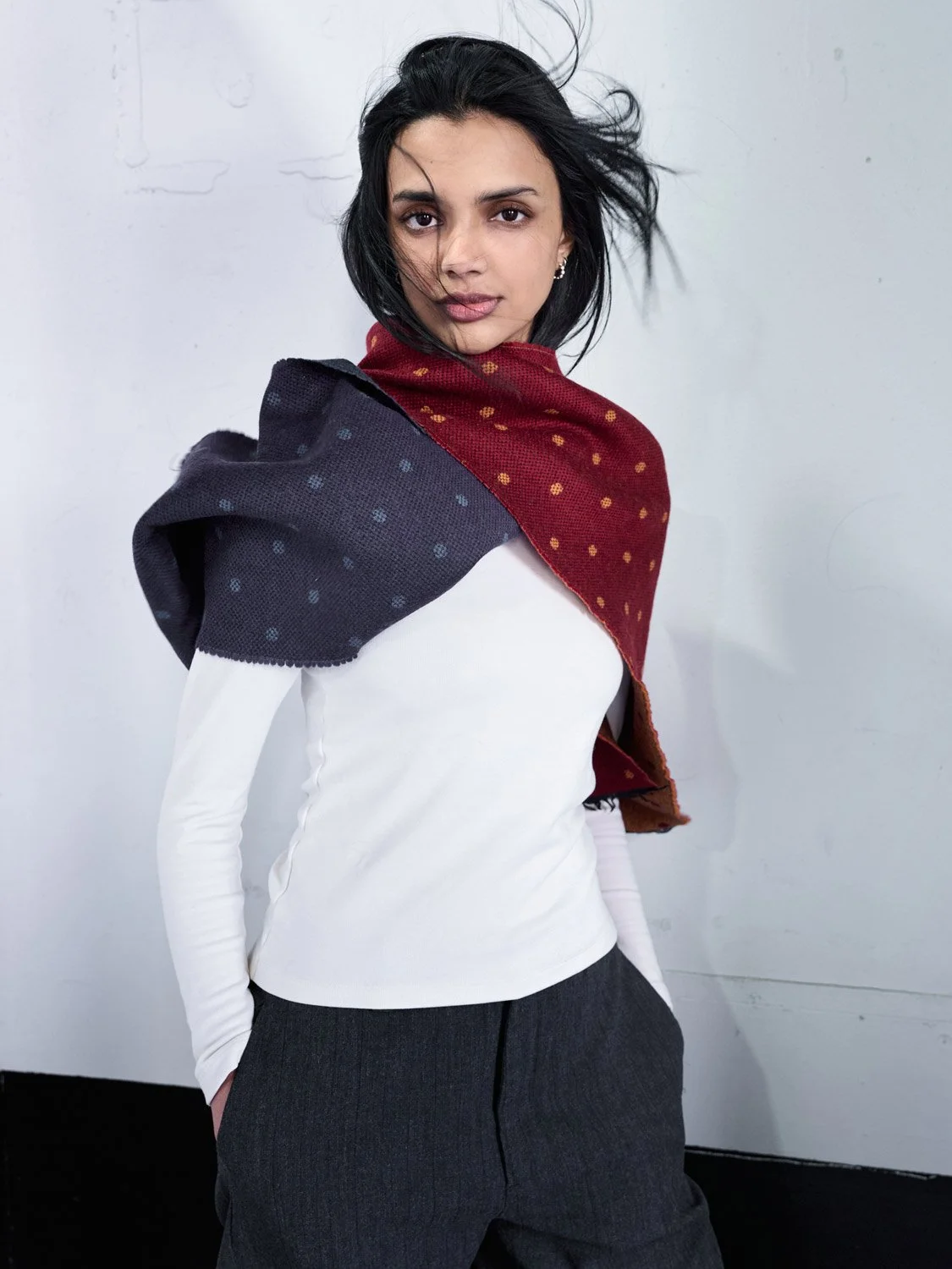 An Indian beautifu female fashion model wearing an Hermes scarf over her shoulders.