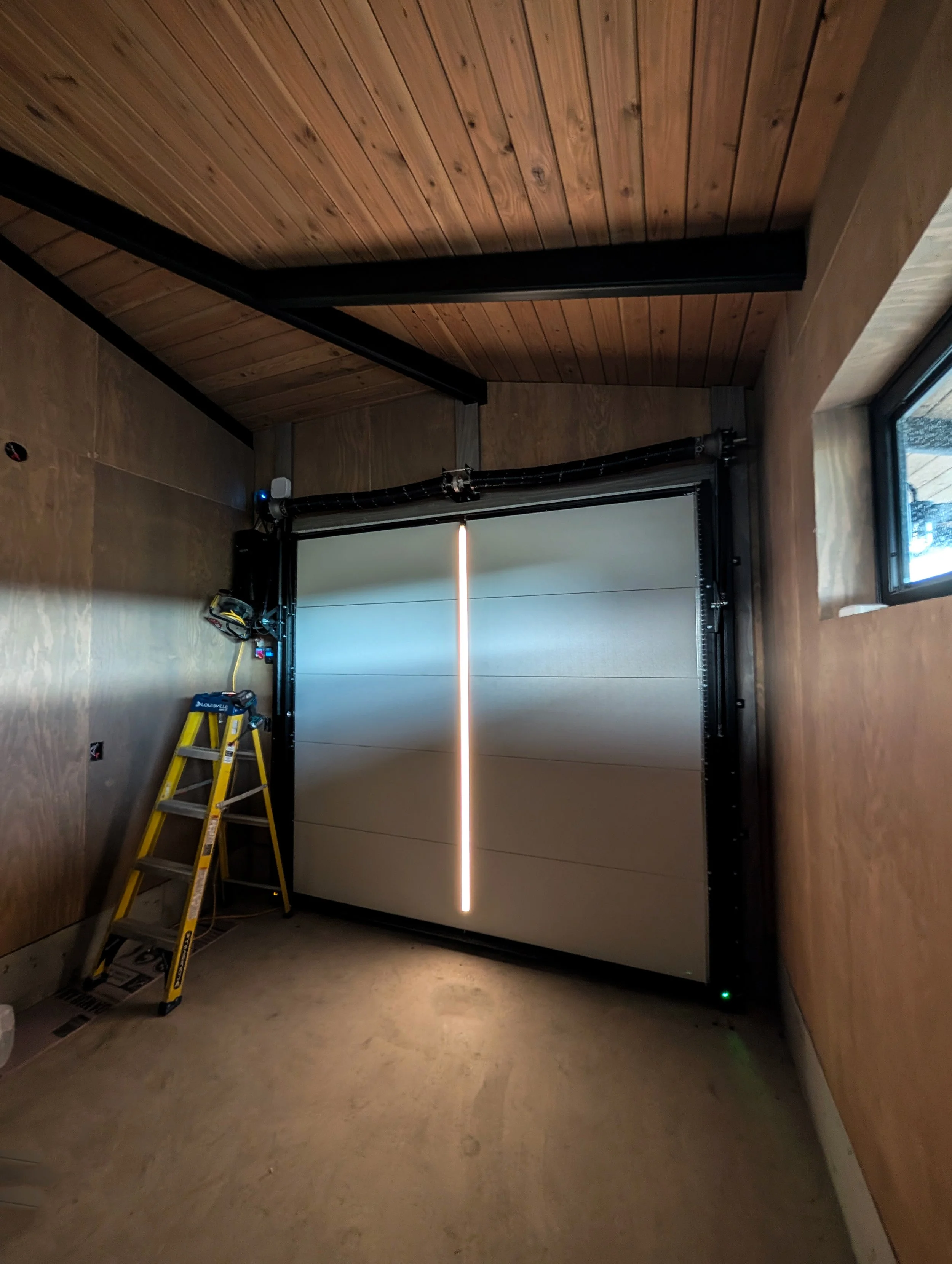 Garage with an open architectural ceiling and no overhead track