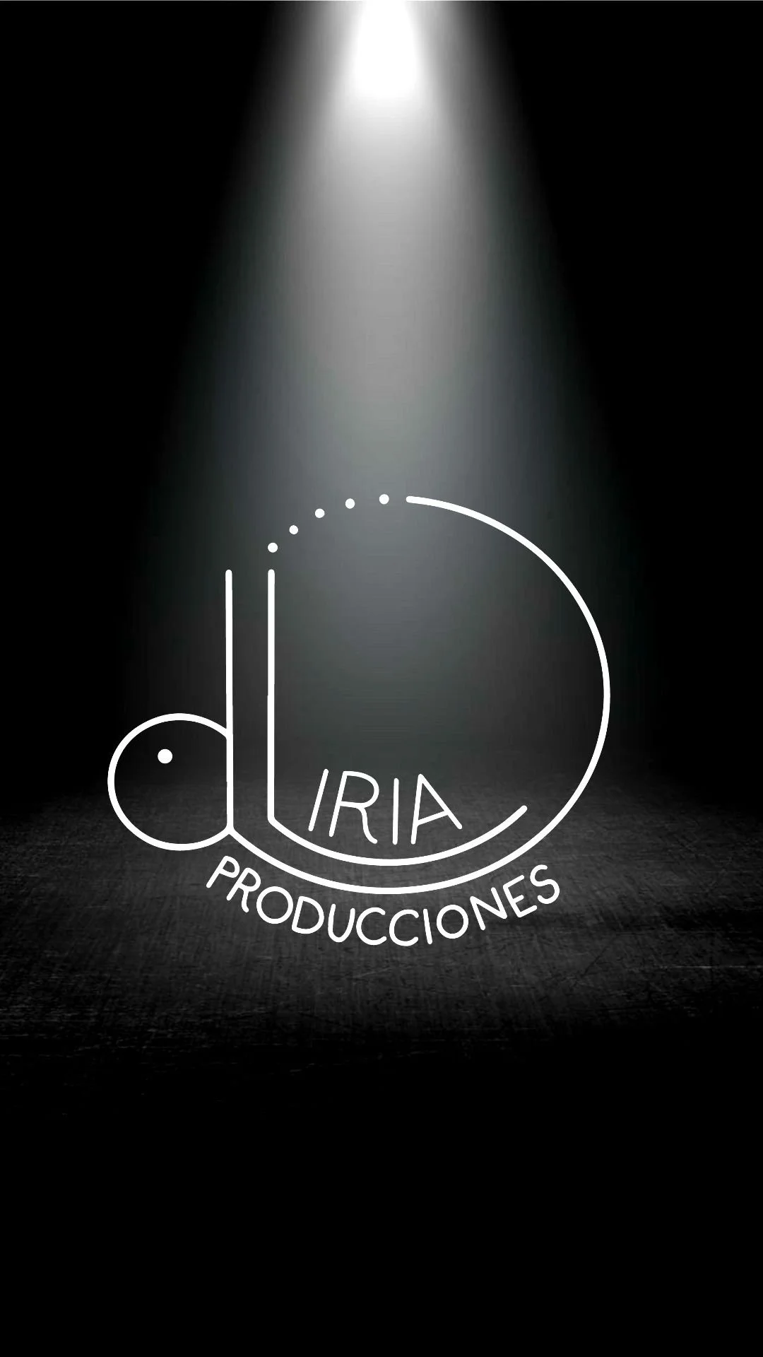 Logotipo en el centro con la palabra 'Diria' y 'Producciones' en letras curvas debajo, con iluminación que enfoca en el logo en un fondo oscuro.