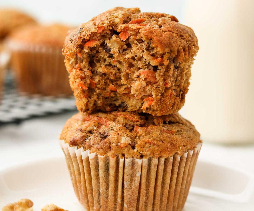 Two carrot cake muffins stacked on each other