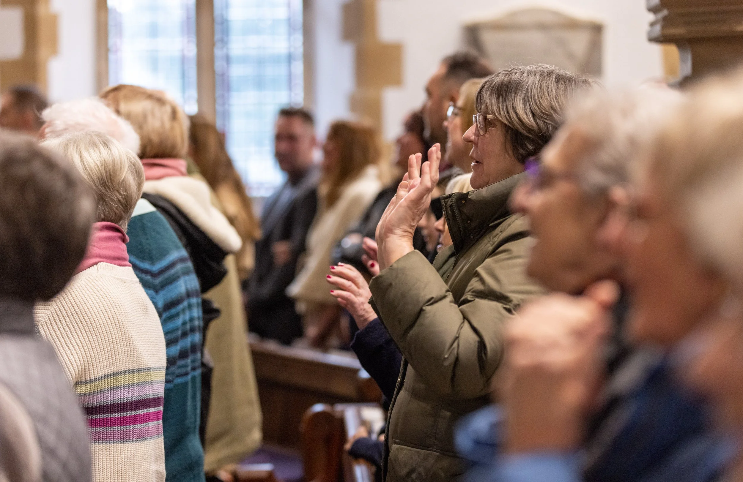 People attending a church service or gathering inside a church.