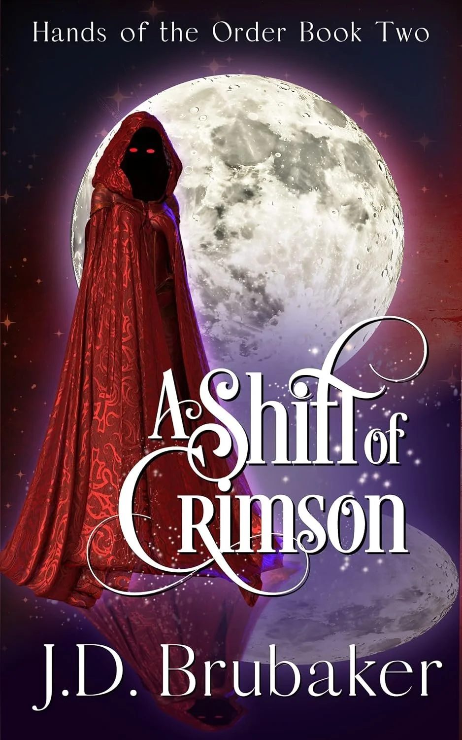 The book cover for "A Shift of Crimson" by J.D. Brubaker features a figure in a red, ornate cloak with a hood, their face obscured with glowing red eyes, standing in front of a large, bright full moon. The background is a starry, purple and red space scene. The title is displayed prominently in white swirling script, with the author's name at the bottom.