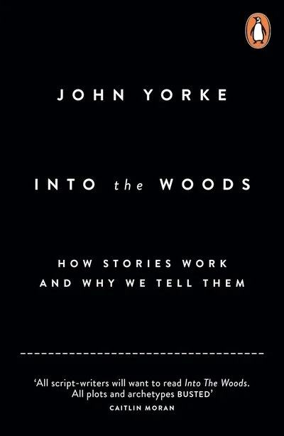 Book cover of 'Into the Woods' by John Yorke with black background and white text, featuring the Penguin logo in the top right corner.