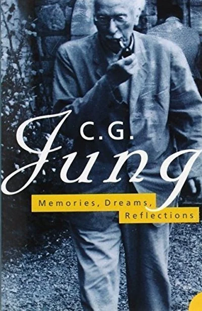 Book cover titled "C.G. Jung: Memories, Dreams, Reflections" featuring a black and white photo of Carl Jung smoking a pipe.