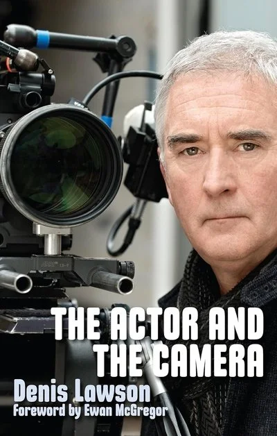 Book cover titled "The Actor and the Camera" by Denis Lowson with a foreword by Ewan McGregor, featuring a middle-aged man with gray hair next to a professional film camera.
