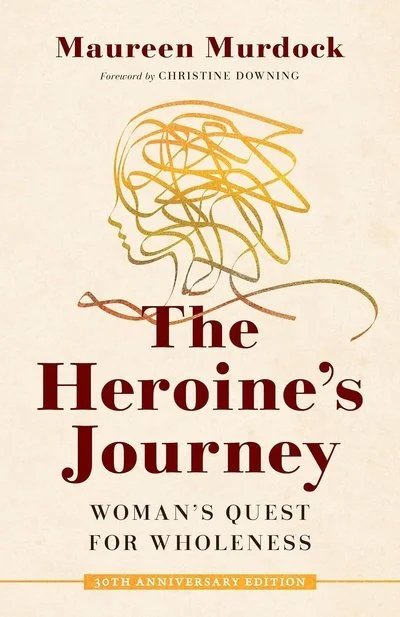 Cover of a book titled 'The Heroine's Journey: Woman's Quest for Wholeness' by Maureen Murdock, with a sketch of a woman's profile combining a line drawing and an abstract scribble of hair.