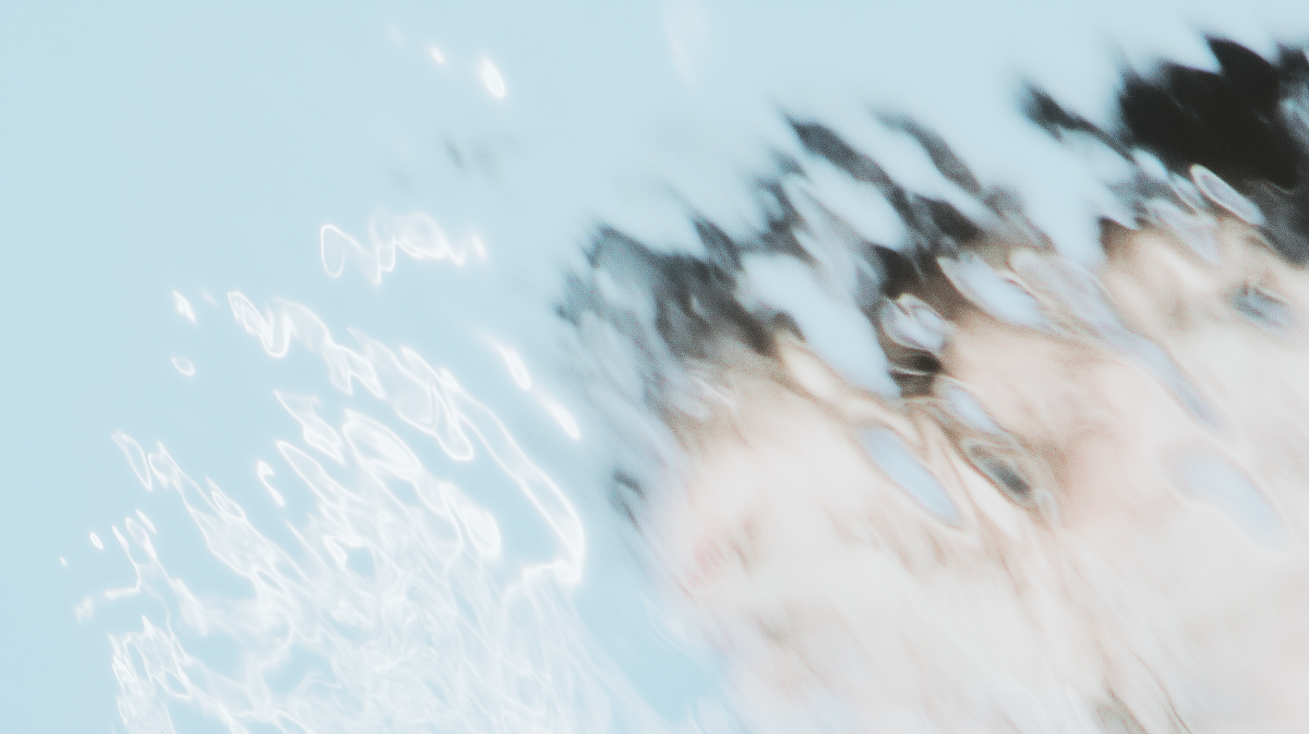 Blurred image of a person with black hair, with a light blue sky in the background and white light streaks.