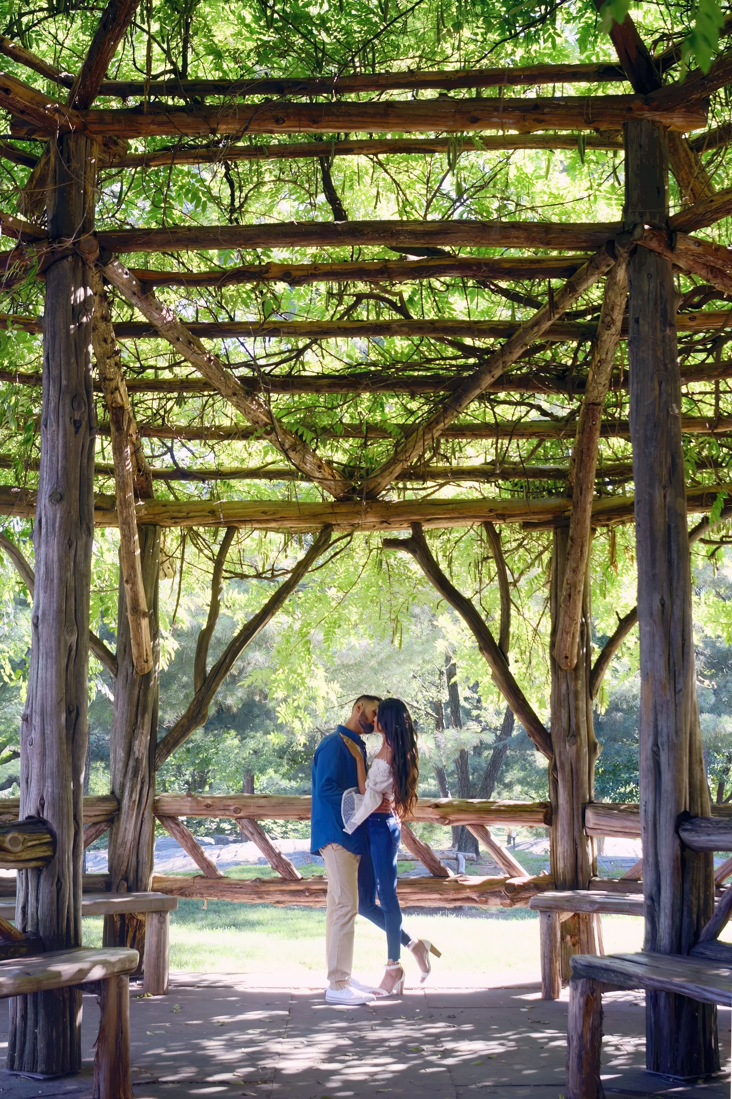 A couple kissing under the Cop Cot in Central Park