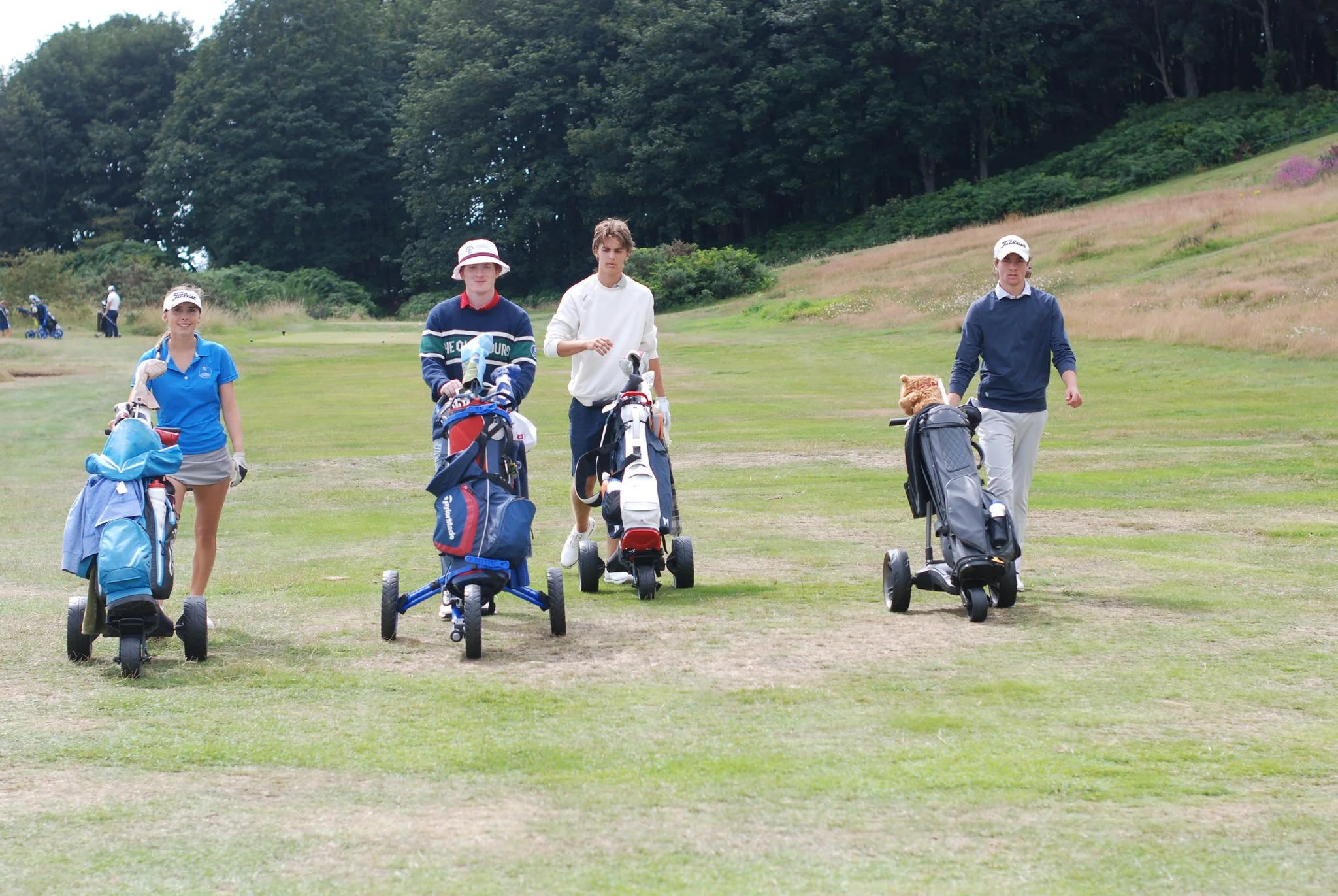 Junior golfers playing together on a Scottish golf course during an RV Golf Schools summer camp.